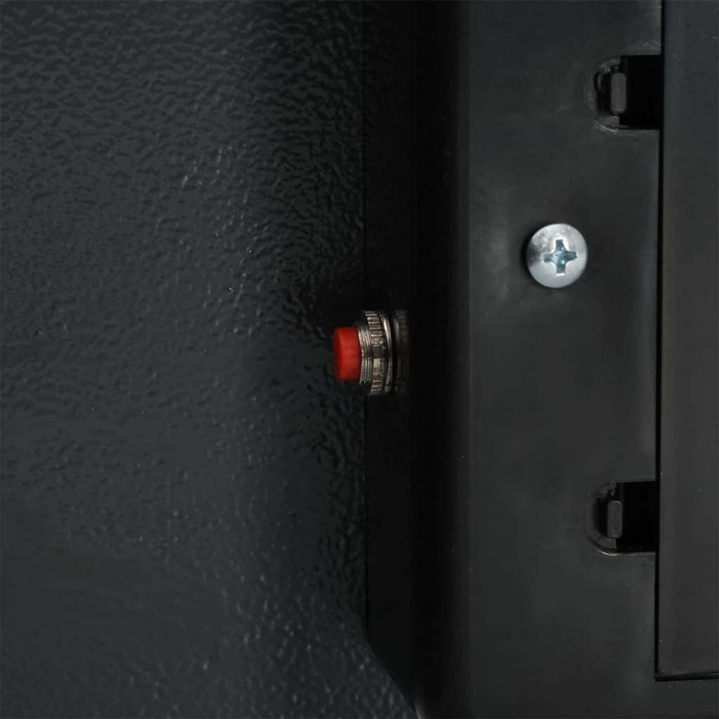 Bouton de réinitialisation rouge sécurisé à l'intérieur de la porte du coffre fort numérique Mon Rempart en acier gris